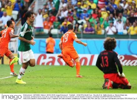 Football - 2014 FIFA World Cup - Round of 16: Netherlands vs. Mexico Klaas Jan Huntelaar of Netherlands runs off to celebrate after he scores a penalty at the Estadio Castelao, Fortaleza COLORSPORT IAN MACNICOL  5229-1