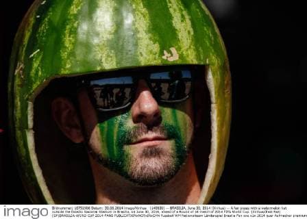 (140630) -- BRASILIA, June 30, 2014 (Xinhua) -- A fan poses with a watermelon hat outside the Estadio Nacional Stadium in Brasilia, on June 30, 2014, ahead of a Round of 16 match of 2014 FIFA World Cup. (Xinhua Jhon Paz) (SP)BRASILIA-WORD CUP 2014-FANS 