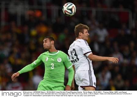 Porto Alegre, 30.06.2014 - Thomas Müller (GER) and Faouzi Ghoulam (ALG) during match between Germany and Algeria at the FIFA World Cup 2014, in Porto Alegre. 