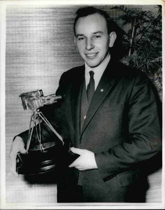 Dec. 12, 1959 - John Surtees is chosen as TV s Sportsman of the year: John Surtees, the fastest man in the world on a motor-cycle, was last night chosen to Sports Personality of 1959 by B.B.C. Television s Sportsview Surtees, world motor-cycling champion for the second year in succession, was presented with the trophy a miniature television camera by Sir John Hunt, of Everest fame. Photo shows John Surtees the fastest man in the world a motorcycle pictured with his trophy after the presentation last night.  - ZUMAk09