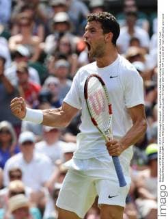 Grigor Dimitrov celebrates winning the second set on Centre Court. 