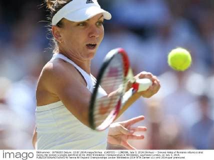 (140703) -- LONDON, July 3, 2014 (Xinhua) -- Simona Halep of Romania returns a shot during the women s singles semifinal at the 2014 Wimbledon Championships in Wimbledon, southwest London, on July 3, 2014. 