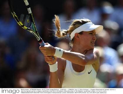 (140703) -- LONDON, July 3, 2014 (Xinhua) -- Eugenie Bouchard of Canada returns a shot during the women s singles semifinal at the 2014 Wimbledon Championships in Wimbledon, southwest London, on July 3, 2014. 