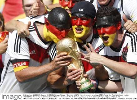 Germany s (DFB) fans cheer with a replica of FIFA World Cup Trophy before a match of 2014 FIFA World Cup at the Estadio do Maracana Stadium in Rio de Janeiro, , on July 4, 2014.(Xinhua WangxLili)(pcy) (SP) RIO DE JANEIRO-WORLD CUP 2014-