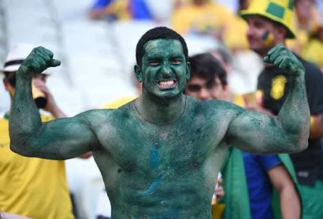 A Brazil s fan poses before a match of 2014 FIFA World Cup at the Estadio Castelao Stadium in Fortaleza , on July 4, 2014.(Xinhua LixGa)(pcy) (SP) FORTALEZA-WORLD CUP 2014-QUARTERFINALS- 