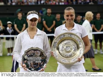 (140705) -- LONDON, July 5, 2014 (Xinhua) -- Czech Republic s Petra Kvitova (front R) and Canada s Eugenie Bouchard pose with their trophies during the award ceremony after the women s singles final match at the 2014 Wimbledon Championships in Wimbledon, southwest London, on July 5, 2014. (Xinhua Meng Yongmin) (SP)BRITAIN-LONDON-TENNIS-WIMBLEDON-WOMEN S SINGLES FINAL 