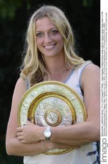 Czech Republic s Petra Kvitova poses with her second Ladies single trophy of the Wimbledon Championships in Prague, Czech Republic, on July 7, 2014. (CTKxPhoto MichalxKamaryt) CTKPhotoOF201407071110301  vnd 2