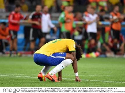 (140708) -- BELO HORIZONTE, July 8, 2014 (Xinhua) -- Brazil s Dante reacts after a semifinal match between Brazil and Germany of 2014 FIFA World Cup at the Estadio Mineirao Stadium in Belo Horizonte, Brazil, on July 8, 2014. Germany won 7-1 over Brazil and qualified for the final on Tuesday.(Xinhua Li Ga)(rh) (SP)BRAZIL-BELO HORIZONTE-WORLD CUP 2014-SEMIFINALS-BRAZIL VS GERMANY 