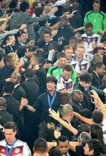 Germany s coach Joachim Löw walks towards the podium with his players after the final match between Germany and Argentina of 2014 FIFA World Cup at the Estadio do Maracana Stadium in Rio de Janeiro, on July 13, 2014. 