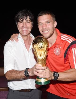 Lukas PODOLSKI (Deutschland) r und Bundestrainer Trainer Joachim Jogi Löw (Deutschland) l mit dem Weltpokal WM-Pokal. DFB-WM Party Gala Feier nach dem Finale im Hotel Sheraton Rio de Janeiro. - Deutschland - Argentinien, Finale, Fussball Weltmeisterschaft 2014,Rio de Janeiro, 13.07.2014- Germany vs. Argentina- FIFA- Soccer World Cup 2014 - poolphoto