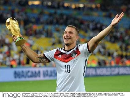 Lukas Podolski of Germany celebrates with the trophy following the 2014 FIFA World Cup Final at the Estadio do Maracana in Rio de Janeiro, Brazil on July 13, 2014.  RIO2014071307