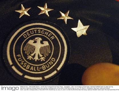 Shanghai - JULY 14:A badge of Germany national football team is seen during Germany national football team winning the championship of the 2014 FIFA World Cup on July 14, 2014 in Shanghai. Germany national football team won the championship of the 2014 FIFA World Cup on July 14, and it is the fourth time that Germany national football team took the championship of the FIFA World Cup.  CFP454930235 