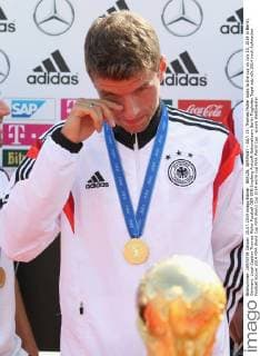 BERLIN, GERMANY - JULY 15: Thomas Müller looks to the cup on July 15, 2014 in Berlin, Germany. Local Caption Thomas Müller