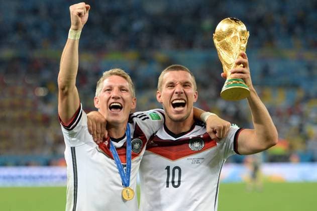 v.li:Bastian SCHWEINSTEIGER (GER),Lukas PODOLSKI (GER) mit Pokal,Jubel,Freude,Begeisterung, Siegerehrung,Cup,Trophy, Trophäe. Deutschland (GER))-Argentinien (ARG) 1-0 n.V Finale,Final,Spiel 64, am 13.07.2014 in Rio de Janeiro. Fussball Weltmeisterschaft 2014 vom 12.06. - 13.07.2014.