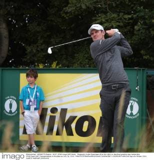 England s Justin Rose tees of on the 18th on the final practice day before the 2014 Open Golf Championships in Hoylake on July 16, 2014.  LON2014071609