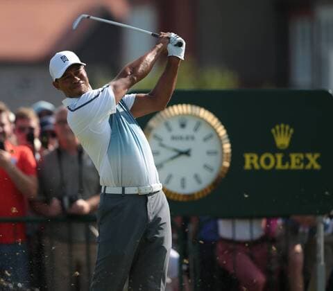 American Tiger Woods tees of on the 3rd hole on the first day of the 2014 Open Golf Championships in Hoylake on July 17, 2014.  LON2014071705