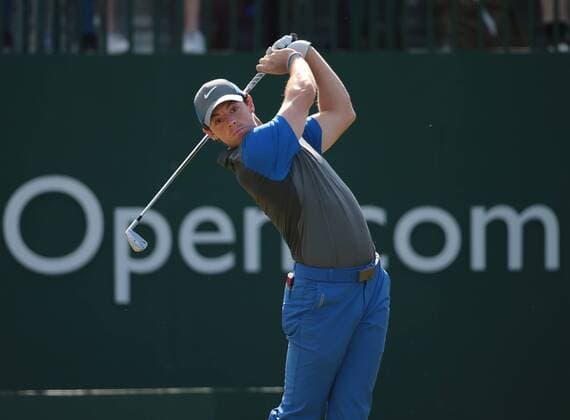 Northern Ireland s Rory McIlroy ( Mc Ilroy ) tees of on the 1st hole on the first day of the 2014 Open Golf Championships in Hoylake on July 17, 2014.  LON2014071702
