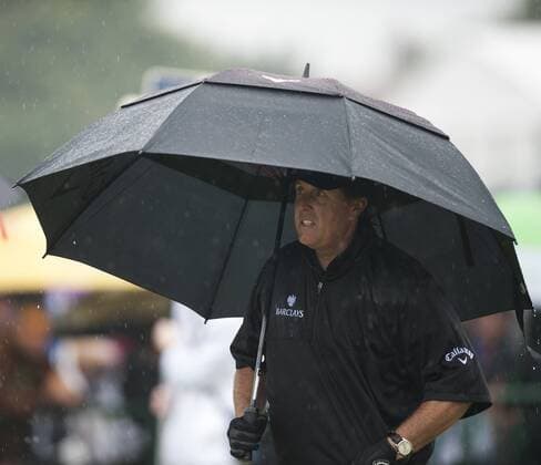19.07.2014. Hoylake, England. The Open Golf Championship, Round 3. Phil MICKELSON USA gets ready to tee off in very wet conditions on the 3rd day. xStephenxBartholomewx  ActionPlus5538