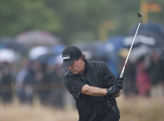 19.07.2014. Hoylake, England. The Open Golf Championship, Round 3. Phil MICKELSON USA approaches the green in very wet conditions on the 3rd day. xStephenxBartholomewx  ActionPlus5539