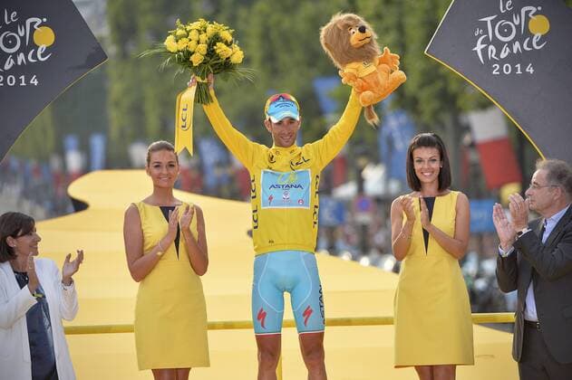 20140727 - PARIS, FRANCE: Italian Vincenzo Nibali of Astana Pro Team wearing the yellow jersey of leader in the overall ranking celebrates on the podium after the last stage of the 101st edition of the Tour de France cycling race, 137,5km from Evry to Paris Champs-Elysees, France, on Sunday 27 July 2014. DAVIDxSTOCKMAN  premiumd Highlight 04266152