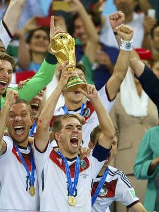 (L-R) Lukas Podolski of Germany, Philipp Lahm of Germany with world cup trophy during the final of the FIFA World Cup 2014 on July 13, 2014 at the Maracana stadium in Rio de Janeiro. . Germany v Argentina FIFA World Cup final 2013 2014 xVIxxIVx 2479362
