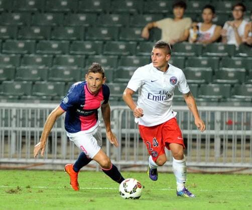 Marco Verratti of France s Paris Saint-Germain, right, challenges Juan Carlos Rodriguez Belencoso of Hong Kong s Kitchee during their friendly football match in Hong Kong, China, 29 July 2014. Zlatan Ibrahimovic scored a hat-trick on Tuesday (29 July 2014) as Paris Saint-Germain enjoyed a 6-2 victory over Hong Kong outfit Kitchee. The 32-year-old had his shooting boots working for him and was ably supported by 21-year-old Jean-Christophe Bahebeck who scored his fifth and sixth goals of the pre-season so far. PSG now travel to Beijing in China which will host this season s French Super Cup between the Ligue 1 champions and surprise French Cup winners Guingamp. Zlatan Ibrahimovic scores hat-trick, leading Paris Saint-Germain to defeate Kitchee 6-2 at Hong Kong friendly match  20140729_13459