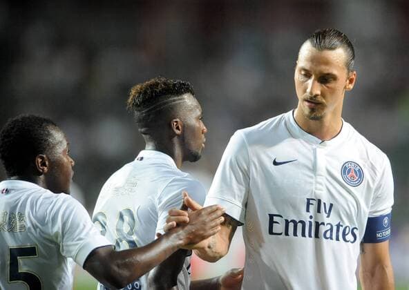 Zlatan Ibrahimovic of France s Paris Saint-Germain, right, celebrates with teammate Hervin Ongenda during their friendly football match against Hong Kong s Kitchee in Hong Kong, China, 29 July 2014. Zlatan Ibrahimovic scored a hat-trick on Tuesday (29 July 2014) as Paris Saint-Germain enjoyed a 6-2 victory over Hong Kong outfit Kitchee. The 32-year-old had his shooting boots working for him and was ably supported by 21-year-old Jean-Christophe Bahebeck who scored his fifth and sixth goals of the pre-season so far. PSG now travel to Beijing in China which will host this season s French Super Cup between the Ligue 1 champions and surprise French Cup winners Guingamp. Zlatan Ibrahimovic scores hat-trick, leading Paris Saint-Germain to defeate Kitchee 6-2 at Hong Kong friendly match  20140729_13461
