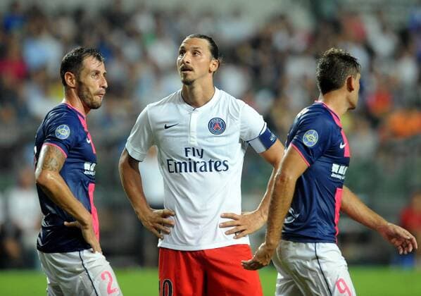 Zlatan Ibrahimovic of France s Paris Saint-Germain, center, looks on next to Fernando Recio Comi, left, and Juan Carlos Rodriguez Belencoso of Hong Kong s Kitchee during their friendly football match in Hong Kong, China, 29 July 2014. Zlatan Ibrahimovic scored a hat-trick on Tuesday (29 July 2014) as Paris Saint-Germain enjoyed a 6-2 victory over Hong Kong outfit Kitchee. The 32-year-old had his shooting boots working for him and was ably supported by 21-year-old Jean-Christophe Bahebeck who scored his fifth and sixth goals of the pre-season so far. PSG now travel to Beijing in China which will host this season s French Super Cup between the Ligue 1 champions and surprise French Cup winners Guingamp. Zlatan Ibrahimovic scores hat-trick, leading Paris Saint-Germain to defeate Kitchee 6-2 at Hong Kong friendly match  20140729_33297