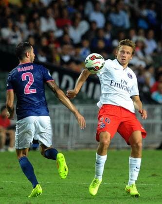 Clement Chantome of France s Paris Saint-Germain, right, challenges Fernando Recio Comi of Hong Kong s Kitchee during their friendly football match in Hong Kong, China, 29 July 2014. Zlatan Ibrahimovic scored a hat-trick on Tuesday (29 July 2014) as Paris Saint-Germain enjoyed a 6-2 victory over Hong Kong outfit Kitchee. The 32-year-old had his shooting boots working for him and was ably supported by 21-year-old Jean-Christophe Bahebeck who scored his fifth and sixth goals of the pre-season so far. PSG now travel to Beijing in China which will host this season s French Super Cup between the Ligue 1 champions and surprise French Cup winners Guingamp. Zlatan Ibrahimovic scores hat-trick, leading Paris Saint-Germain to defeate Kitchee 6-2 at Hong Kong friendly match  20140729_47759