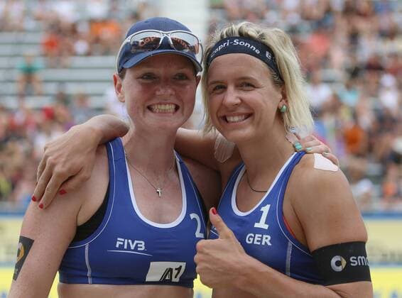 BEACH VOLLEYBALL - FIVB, Grand Slam Klagenfurt KLAGENFURT,AUSTRIA,30.JUL.14 - BEACH VOLLEYBALL- FIVB World Tour 2014, Grand Slam Klagenfurt. Image shows the rejoicing of Julia Sude and Laura Ludwig (GER). 