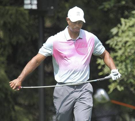 July 31, 2014 - Akron, OH, USA - Tiger Woods bends his club after hitting a errant tee shot on the 2nd hole during the first round in the WGC-Bridgestone Invitational at Firestone Country Club in Akron, Ohio, on Thursday, July 31, 2014. WGC-Bridgestone Invitational, first round - ZUMAm67