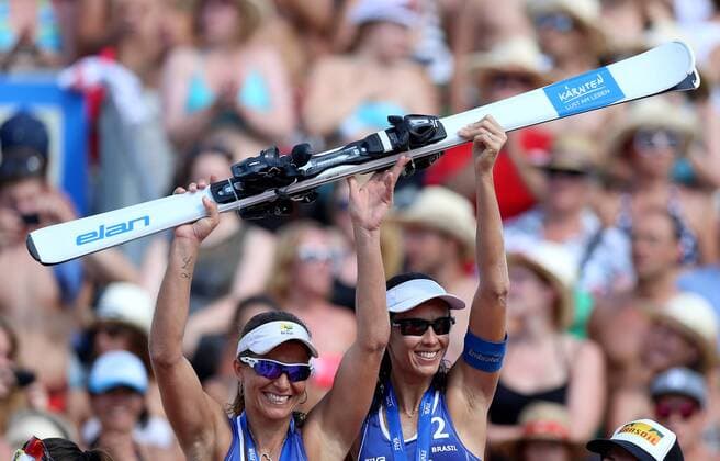 BEACH VOLLEYBALL - FIVB, Grand Slam Klagenfurt KLAGENFURT ,02.AUG.14 - BEACH VOLLEYBALL - FIVB World Tour 2014, Grand Slam Klagenfurt, award ceremony. Image shows the rejoicing of Larissa Franca and Talita Da Rocha Antunes (BRA). 