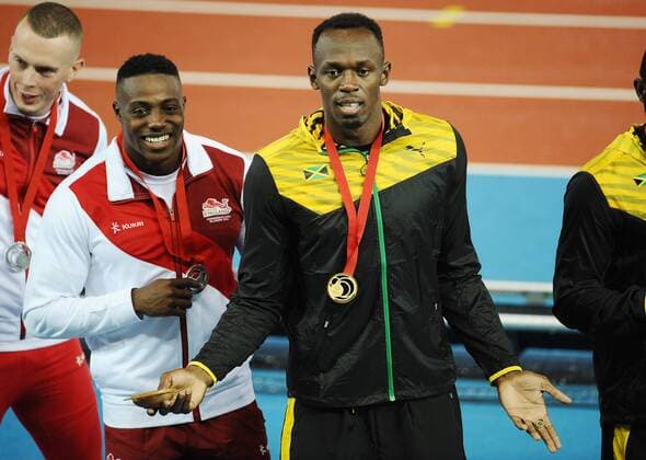 Athletics - 2014 Glasgow Commonwealth Games - Day Ten Mens 4 x 100m final Jamaica s Usain Bolt with his gold medal at Hampden Park COLORSPORT ANDREW COWIE 