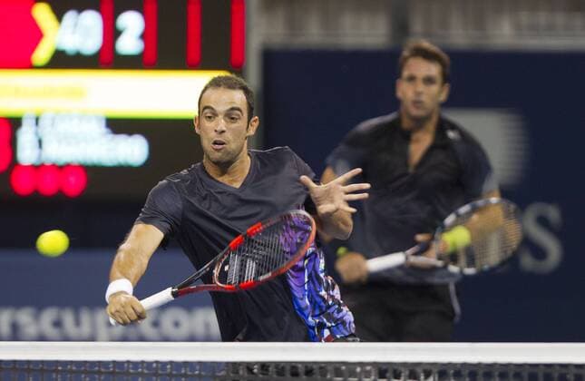 TORONTO, Aug. 4, 2014 -- Juan Sebastian Cabal (L) of Colombia and David Marrero of Spain compete during the first round of men s doubles at the 2014 Rogers Cup in Toronto, Canada, Aug. 4, 2014. (SP)CANADA-TORONTO-TENNIS-ROGERS CUP-MEN S DOUBLES ZouxZheng 