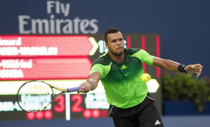 TORONTO, Aug. 4, 2014 -- Jo-Wilfried Tsonga of France returns the ball during the first round of men s singles at the 2014 Rogers Cup in Toronto, Canada, Aug. 4, 2014. (SP)CANADA-TORONTO-TENNIS-ROGERS CUP-MEN S SINGLES ZouxZheng 