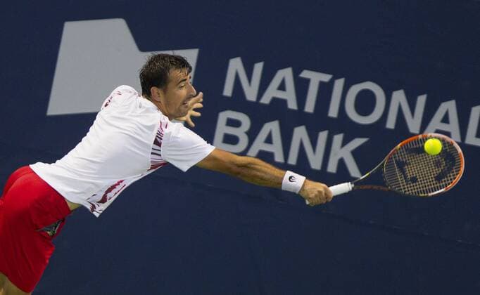 TORONTO, Aug. 4, 2014 -- Ivan Dodig of Croatia returns the ball during the first round of men s singles at the 2014 Rogers Cup in Toronto, Canada, Aug. 4, 2014. (SP)CANADA-TORONTO-TENNIS-ROGERS CUP-MEN S SINGLES ZouxZheng 