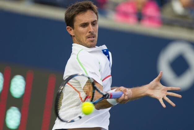 TORONTO, Aug. 4, 2014 -- Edouard Roger-Vasselin of France returns the ball during the first round of men s singles at the 2014 Rogers Cup in Toronto, Canada, Aug. 4, 2014. (SP)CANADA-TORONTO-TENNIS-ROGERS CUP-MEN S SINGLES ZouxZheng 