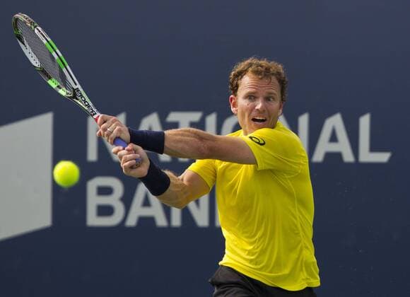 Michael Russell of the United States returns the ball during the second round of men s singles at the 2014 Rogers Cup in Toronto, Canada, Aug. 6, 2014. CANADA-TORONTO-TENNIS-ROGERS CUP-MEN S SINGLES ZouxZheng 