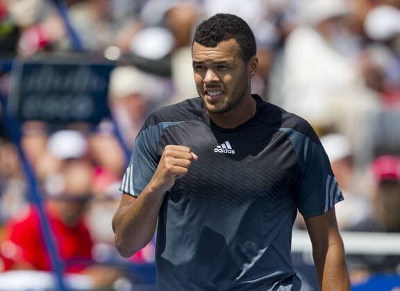Jo-Wilfried Tsonga of France celebrates scoring during the second round of men s singles at the 2014 Rogers Cup in Toronto, Canada, Aug. 6, 2014. CANADA-TORONTO-TENNIS-ROGERS CUP-MEN S SINGLES ZouxZheng 