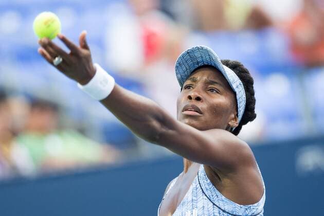 AUG 06, 2014 : Venus Williams (USA) serves during her game in the 2nd round of the Rogers Cup presented by National Bank at Uniprix Stadium in Montreal, Quebec, Canada. TENNIS: AUG 06 Rogers Cup - woman Montreal Icon10169 EDITORIAL USE ONLY