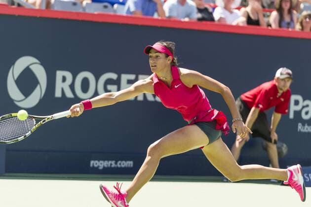 06 August 2014: Caroline Garcia of France hits a return during the second round of the Rogers Cup Presented by National Bank at Uniprix Stadium in Montreal, Quebec, Canada. TENNIS: AUG 06 Rogers Cup - woman Montreal Icon140806007 EDITORIAL USE ONLY