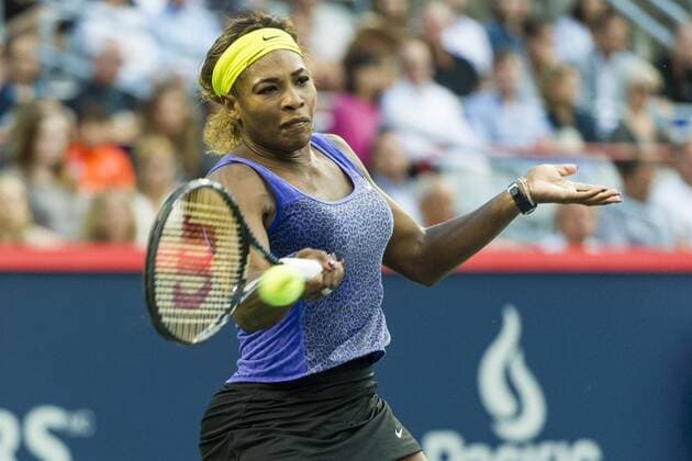 06 August 2014: Serena Williams of the United States hits a return during the second round of the Rogers Cup Presented by National Bank at Uniprix Stadium in Montreal, Quebec, Canada. TENNIS: AUG 06 Rogers Cup - woman Montreal Icon140806036 EDITORIAL USE ONLY