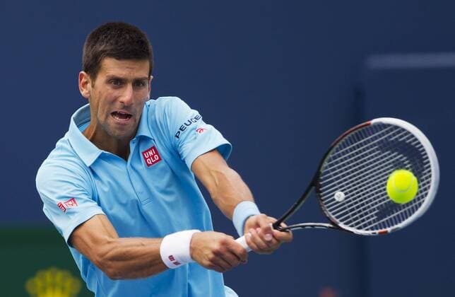 Novak Djokovic of Serbia returns the ball during the third round of men s singles at the 2014 Rogers Cup in Toronto, Canada, Aug. 7, 2014. 