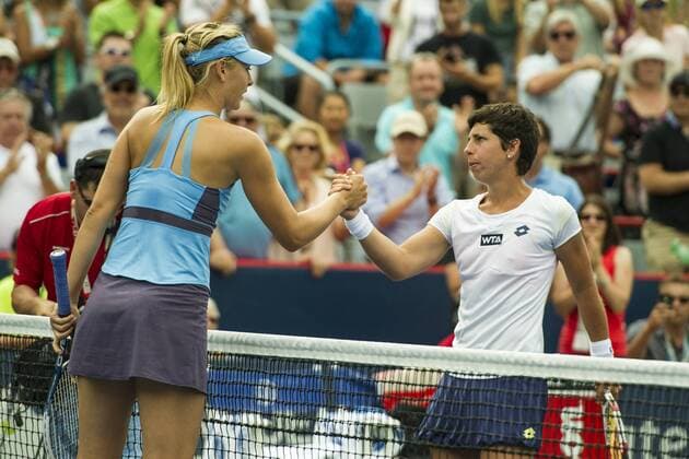 07 August 2014: Maria Sharapova of Russia congratulates Carla Suarez Navarro of Spain for her victory during the third round of the Rogers Cup Presented by National Bank at Uniprix Stadium in Montreal, Quebec, Canada. Icon10608 EDITORIAL USE ONLY