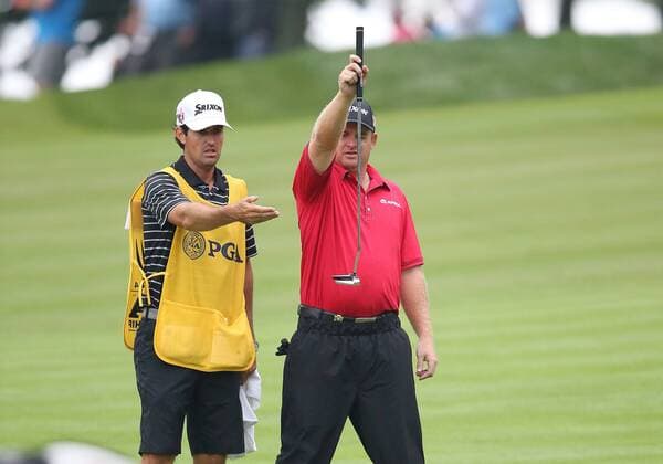 August 8, 2014: J. B. Holmes and his caddie Brandon Parsons talk over a shot on the 10th hole during the second round of the PGA Golf Herren Championship at Valhalla Golf Club in Louisville, Ky. GOLF: AUG 08 PGA Golf Herren - PGA Golf Herren Championship - Second Round Icon20143447 EDITORIAL USE ONLY