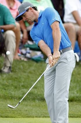 Rory McIlroy, of Northern Ireland, chips onto the seventh green during the third round of the 96th PGA Golf Herren Championship at Valhalla Country Club on .August 9, 2014 in Louisville, Kentucky. McIlroy shot a four under par 67 and has a one stroke lead over Austria s Bernd Wiesberger heading into Sunday s final round.  LOU2014080906