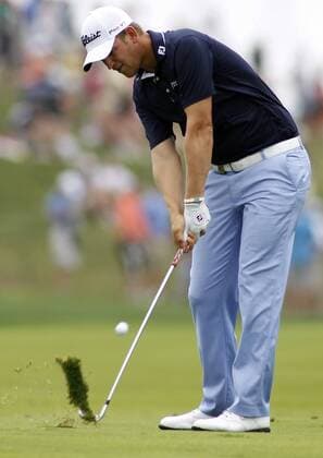 Bernd Wiesberger, of Austria, hits his approach shot to the first green during the third round of the 96th PGA Golf Herren Championship at Valhalla Country Club on .August 9, 2014 in Louisville, Kentucky. Wiesberger shot a six-under 65 and trails leader Rory McIlory by one stroke entering Sunday s final round.  LOU2014080909