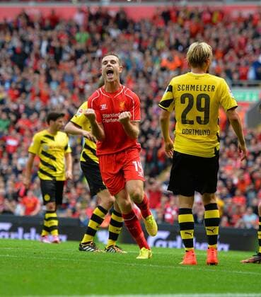 Liverpool s Jordan Henderson celebrates scoring the 4th goal- Pre Season Friendly - Liverpool vs Borussia Dortmund - Anfield Stadium - Liverpool - England - 10th August 2014 - Pic Paul Currie Sportimage EDITORIAL USE ONLY. No use with unauthorised audio, video, data, fixture lists, club league logos or live services. Online in-match use limited to 120 images, no video emulation. No use in betting, games or single club league player publications.