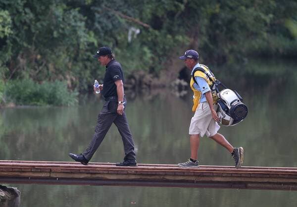 August 10, 2014: Phil Mickelson and his caddie cross the bridge to the ninth tee box during the fourth round of the PGA Golf Herren Championship at Valhalla Golf Club in Louisville, Ky. GOLF: AUG 10 PGA Golf Herren - PGA Golf Herren Championship - Final Round Icon11253 EDITORIAL USE ONLY