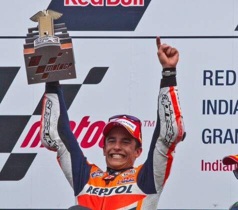 Marc Marquez raises his trophy after winning his second consecutive Red Bull Moto GP at the Indianapolis Motor Speedway on August 10, 2014 in Indianapolis, Indiana.  IND20140801009